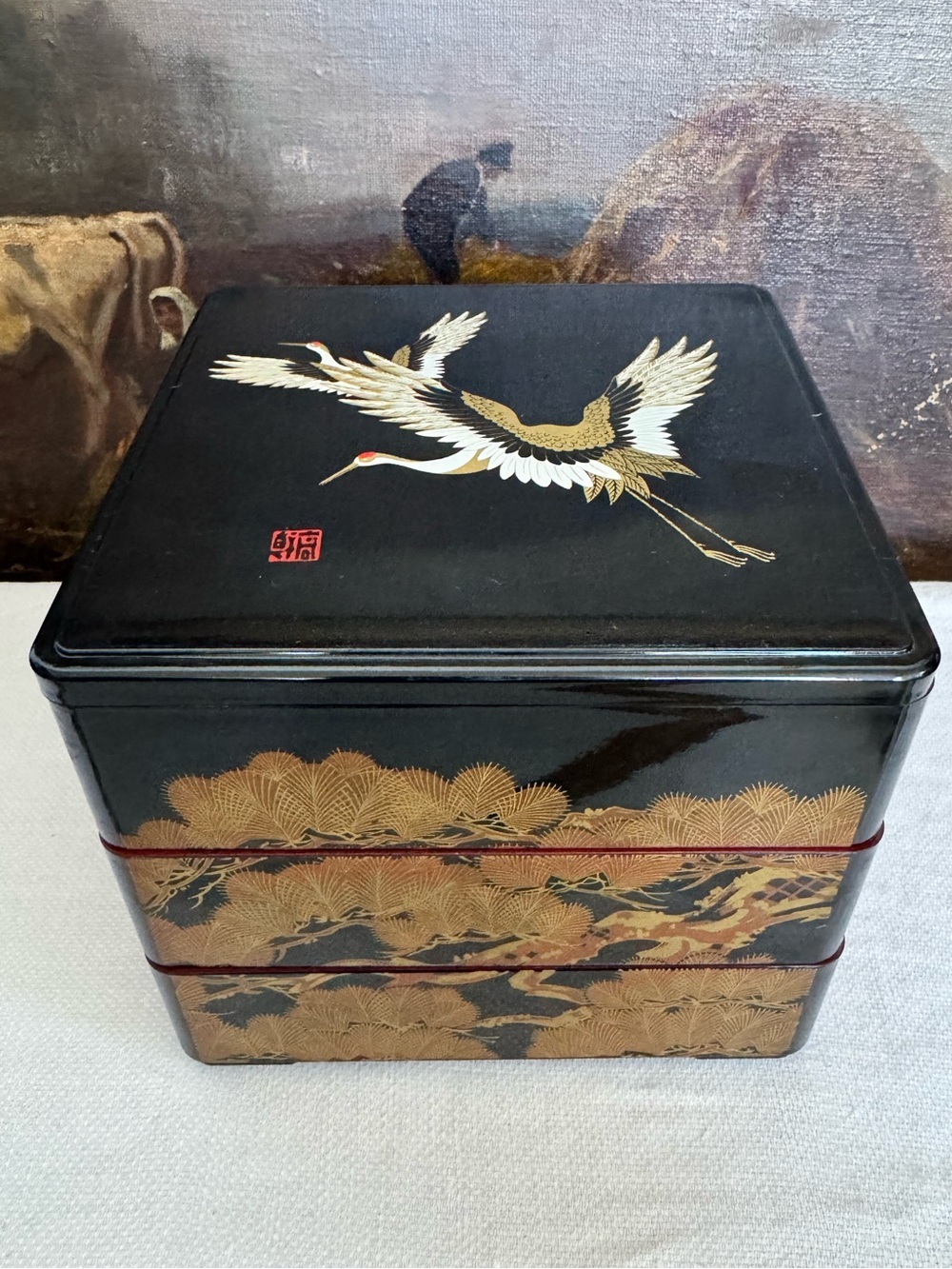 Black three-tier Japanese bento box (ojyu) w crane and landscape motif